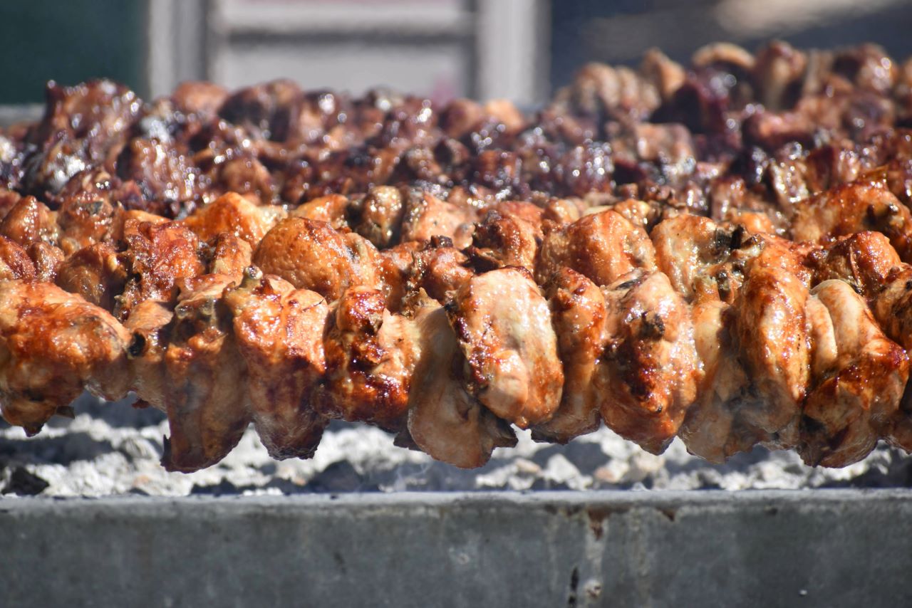 Souvla rotating on a traditional BBQ